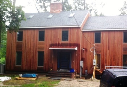 Unique_wood_rain_screen_design_transforms_curb_appeal_of_colonial_home