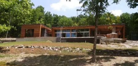 Ipe wood rainscreen siding over wood-frame stud wall assembly