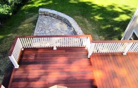 Ipe backyard deck with white rails and Ipe rail cap
