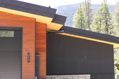 thermally modified hemlock siding and soffits all stained different shades