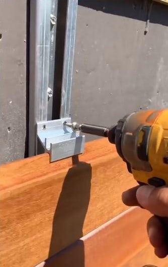 Charlie shows how simple it is to install the CS-10 Rainscreen clip to the attachment channels.  It saves time and labor.  Photo courtesy of Charlie Kawas.