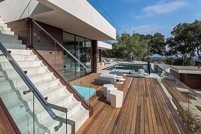 A modern home with high quality wood siding and decking from Mataverde Sustainable Decking and Siding Solutions.